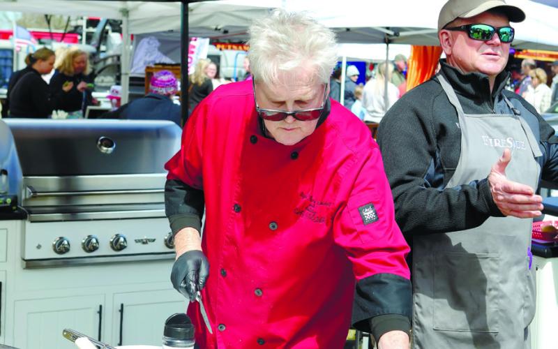 Delicious steak treats are served up by Chef McCord of Ripe Thing Market, accompanied by Greig McCully, owner/president of Kitchen Expert.