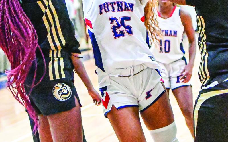 Putnam senior Halana Griffin (25) tries to block a shot taken by a Greene County guard.