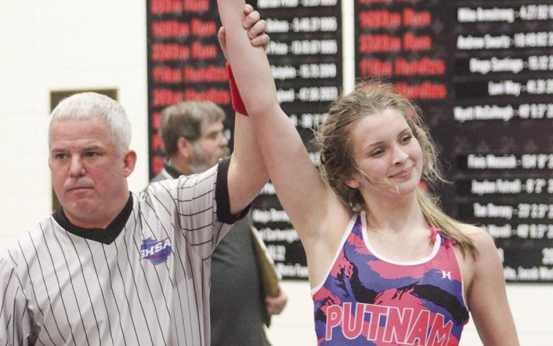 A referee signals that Putnam County’s Lily Armistead (right) won a match during a tournament match in the regular season. KIM CASH/ Contributed
