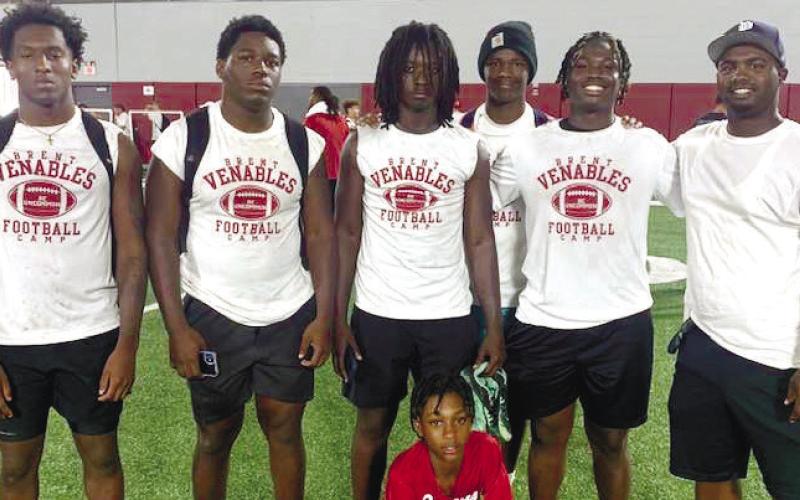 L-R: Kaleb Crawford, Zacoree Wallace, Tyson Waller, Rashod Daniel and Bryson Brown learned a lot thanks to Putnam County defensive backs coach Kedric Manning (far right) during the football camp at the University of Oklahoma last weekend. LANCE MCCURLEY /Staff