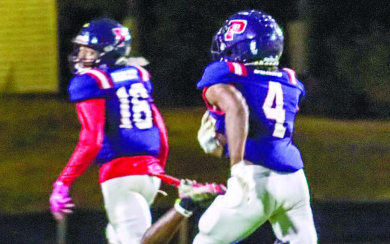 DJ Bland (4) takes a 77-yard jet sweep to the house, which was Putnam’s final score of the lop-sided 44-0 victory. LANCE McCURLEY/Staff