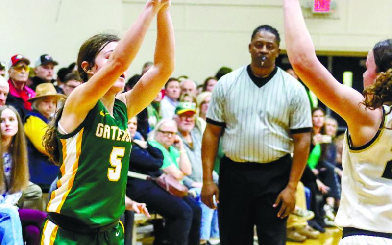 Freshman Natalie Sills (5) shoots for 3 for the Gators. LANCE McCURLEY/Staff