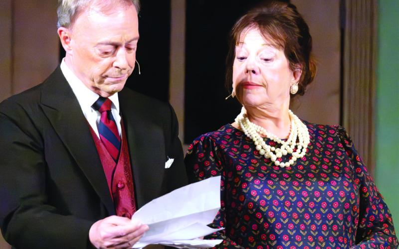 Veteran stage actors Michael Homeier as Sir Lawrence Wargrave and Rusty Faulk as Emily Brent share a reflective moment on stage during LCP’s production of And Then There Were None.LEIGH LOFGREN/Staff