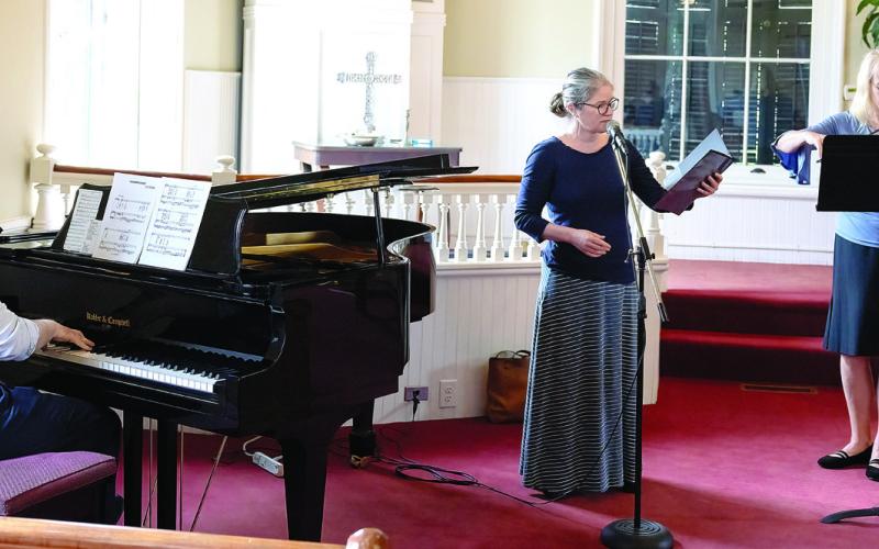 Festival Hall Director Nicole Chillemi, with Rev. Meg Jackson Clarke and Blayne May on piano. LEIGH LOFGREN/Staff