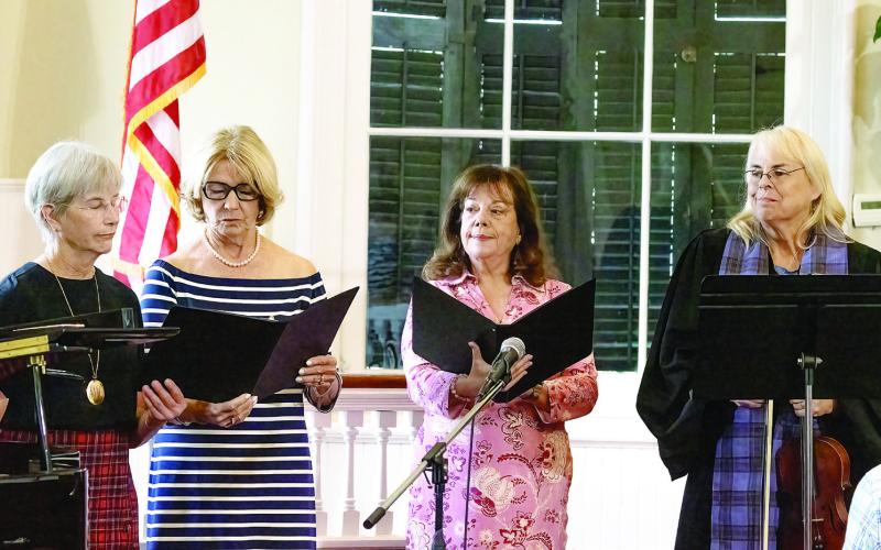 Singers Gail Cavanaugh, Beth Lewis, guest singer Rusty Faulk, and Rev. Meg Jackson Clarke. LEIGH LOFGREN/Staff