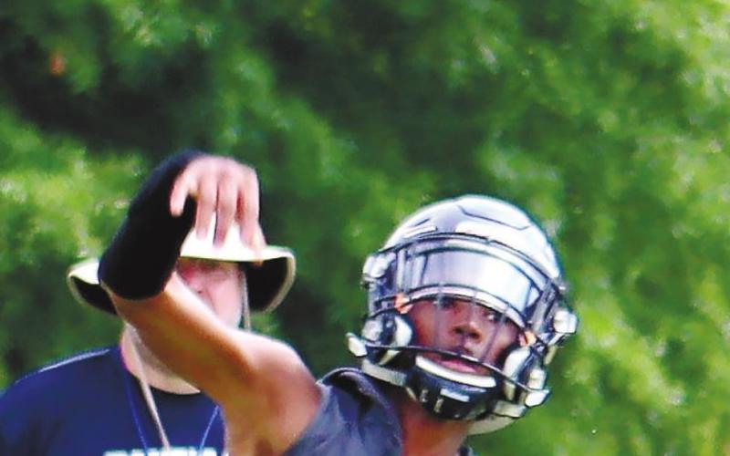 Jamarion Robertson takes some snaps during a 7-on-7 scrimmage earlier this month. ARELLA CASH/Staff