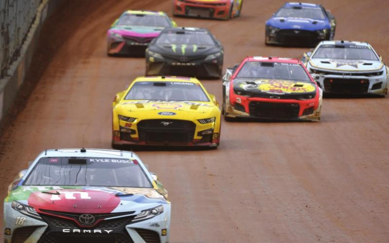 Winner Kyle Busch, driver of the #18 Mars Crunchy Cookie Toyota, drives during the Cup Series Food City Dirt Race at Bristol Motor Speedway Sunday night. (Logan Riely/Getty Images)