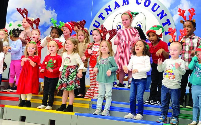 The Pre-K Carolers close the showcase by singing The Reindeer Pokey. BAILEY MCCULLY/Staff