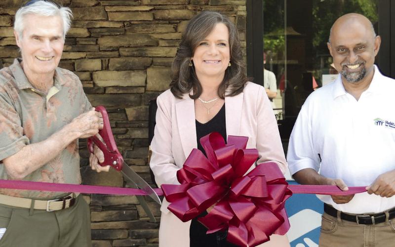 L-R: Habitat for Humanity of Putnam Board President Bucky Kahl, Board Member Linda Moore, and Executive Director Murali Thiramul were all smiles May 16 as the prepared to officially open their new ReStore facility. IAN TOCHER/Staff