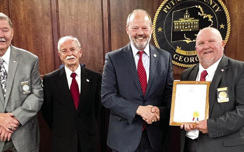 Near the start of the Feb. 2 Putnam County Commission meeting, former Eatonton city attorney Barry Fleming (4th from left) was recognized for being appointed Jan. 10 as a Columbia County Superior Court Judge. Fleming was presented with a certificate and will soon receive a custom-made gavel from (l-r) Putnam County Commission Chair Bill Sharp and Commissioners Gary McElhenney, Steve Hersey, Jeff Wooten, and Daniel Brown. IAN TOCHER/Staff