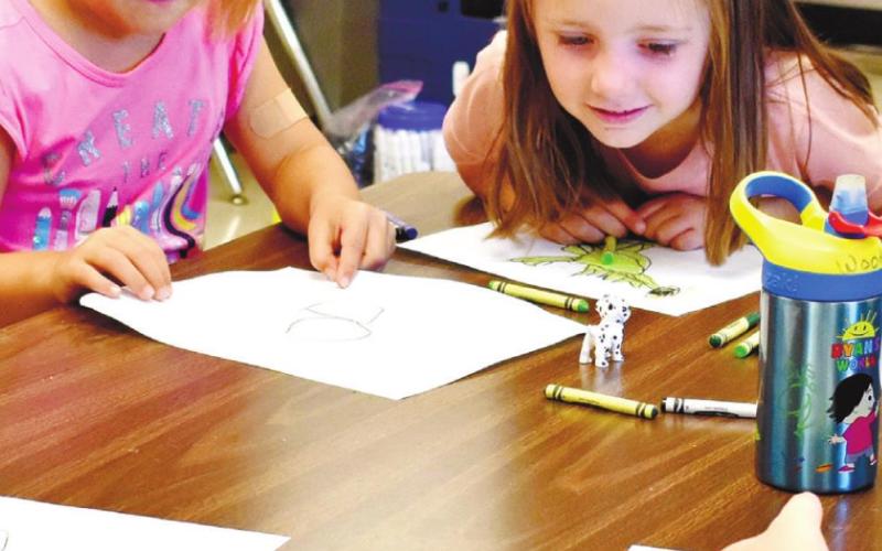 Students create their masterpieces after watching demonstrations from their teacher.
