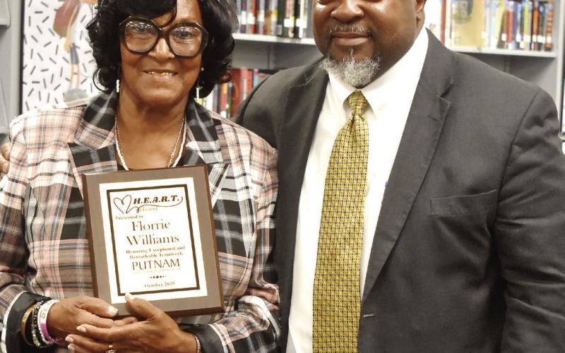 Superintendent Derick Austin (right) with HEART recipient Florrie Willaims. BAILEY BALLARD/Staff