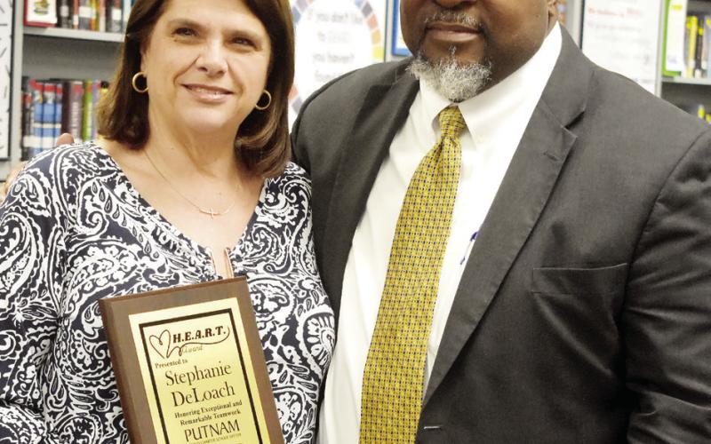 Derick Austin with HEART recipient Stephanie DeLoach. BAILEY BALLARD/Staff