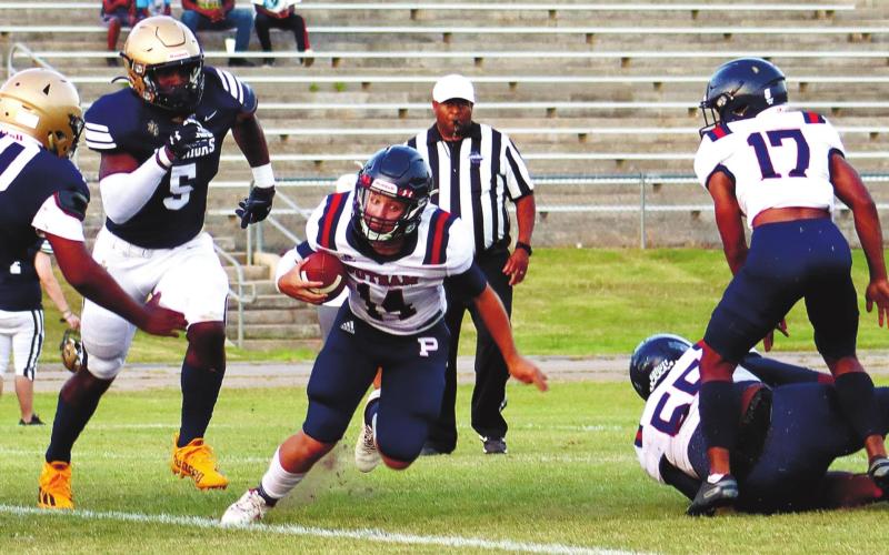 Rhimiair Johnson (55) and Cory Foster (17) make a block for quarterback Branan Griffin (14). ARELLA CASH/Staff