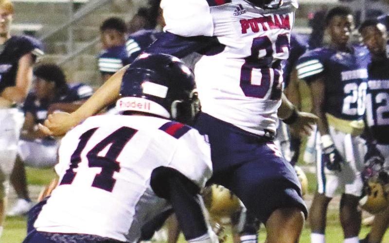 Bryan Canales kicks the extra point while Branan Griffin provides the hold. ARELLA CASH/Staff