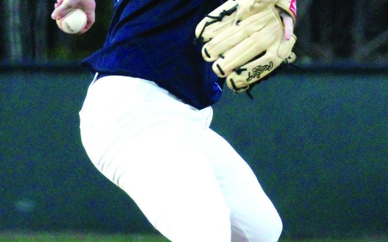 Putnam County pitcher Wade Johnston in the wind=up set to deliver a pitch to an Athens Academy batter last Wednesday. WILL MORRISON/Staff