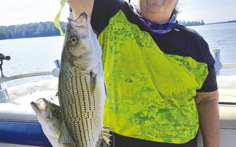 Lake Oconee Striper Club VP Darcy Flynn with a double on a mini-Mack rig. CONTRIUBTED