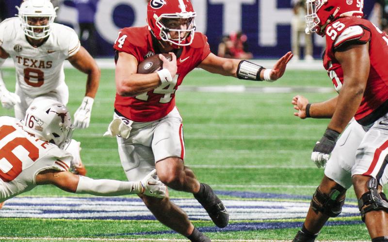 Gunner Stockton (14) will start at quarterback for Georgia against Notre Dame in the Allstate Sugar Bowl on Jan. 1. LANCE McCURLEY/Staff