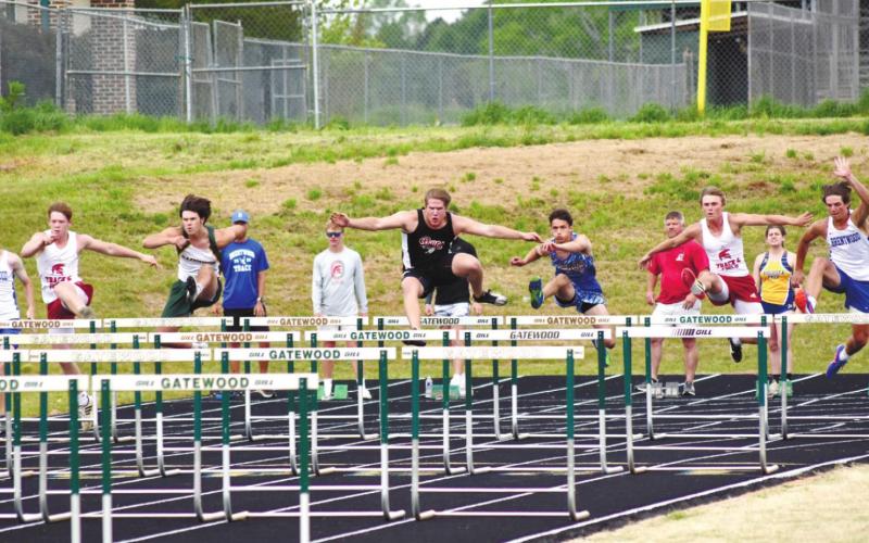Ben Paxson of Gatewood competes with six other athletes in the 100 meter hurdles. T. MICHAEL STONE/Staff
