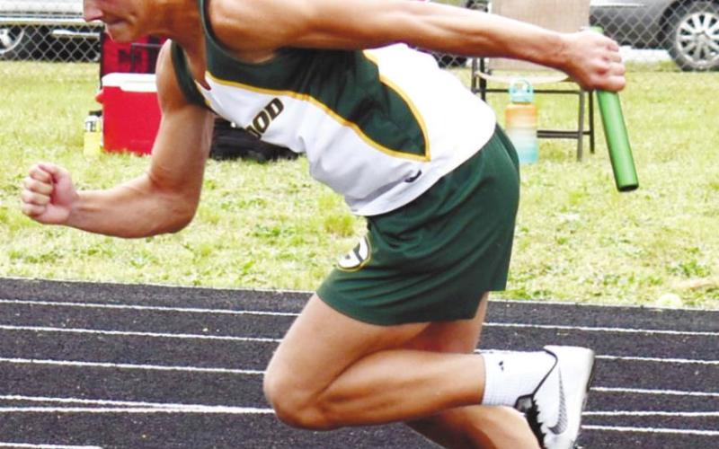 Blake Haley gets out of the blocks strong in the 4X100 relay. T. MICHAEL STONE/Staff