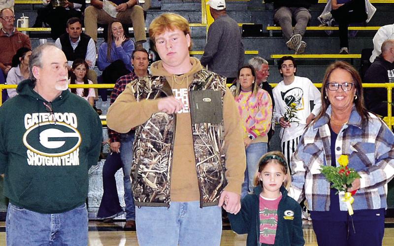 Gatewood wrestler and football team member Blake Daniel was escorted by his parents Lorraine and Roger, with K-5 buddy Averly Smith. Blake plans to attend Emmanuel College to earn a degree in business management. IAN TOCHER/Staff