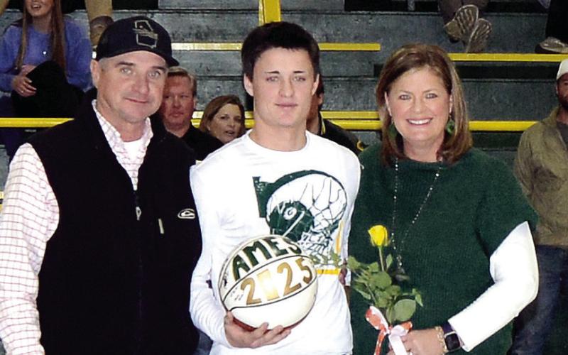 A member of the Gatewood basketball team, Ames Johnson also was quarterback of the school’s football team. Accompanied by his parents Lynn and Mark Johnson, Ames plans to study welding at Ogeechee Technical College. IAN TOCHER/Staff