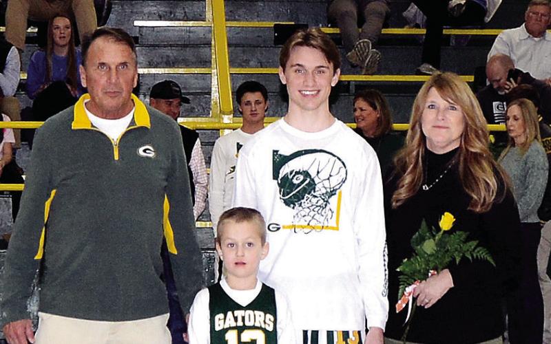Gatewood basketball player Kaden Keiser was accompanied by his parents Joni and Don Keiser, and K-5 buddy Easton Stolley. Kaden crossed the 1,000-point plateau on the hardwood this season and next year plans to attend the University of Georgia to earn both business and law degrees. IAN TOCHER/Staff