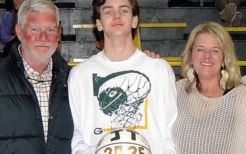 JT Gregory of the Gatewood basketball team was escorted by his parents Cindy and Jay. JT is a member of the Phoenix Chapter of the National Honor Society and will attend Georgia Southern University to major in construction management. IAN TOCHER/Staff