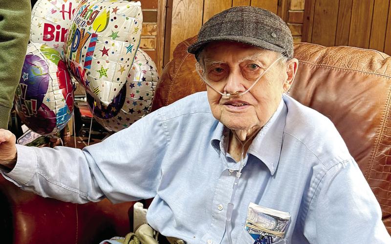 James Dooley is all smiles for his 100th birthday Friday. LYNN HOBBS/Staff