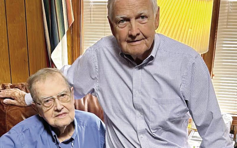 The Dooley brothers, James and Charles, enjoy regular visits with each other. LYNN HOBBS/Staff