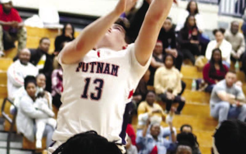Brixton Woodall (13) with rebound and put back adds 2 points for the War Eagle. ARELLA CASH/Staff