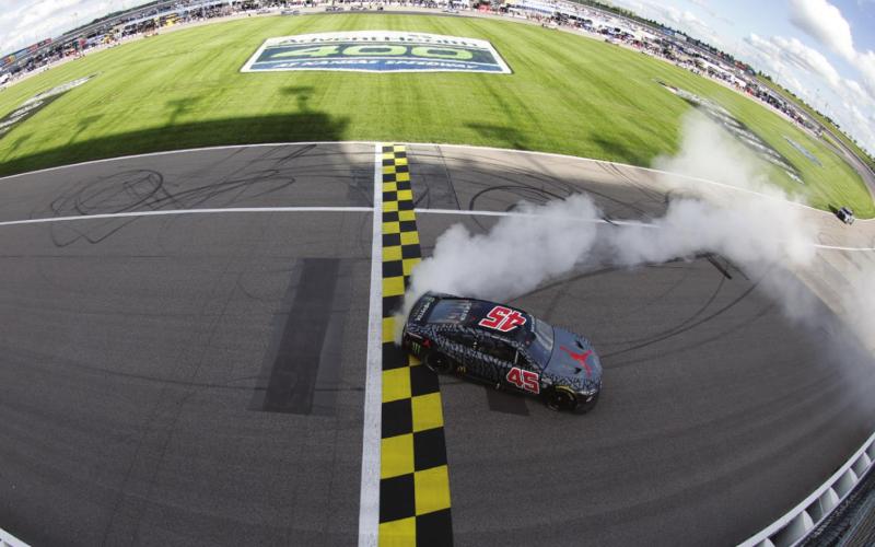 Kurt Busch, driver of the #45 Jordan Brand Toyota, celebrates with a burnout after winning the Cup Series AdventHealth 400 at Kansas Speedway Sunday. (Sean Gardner/Getty Images)