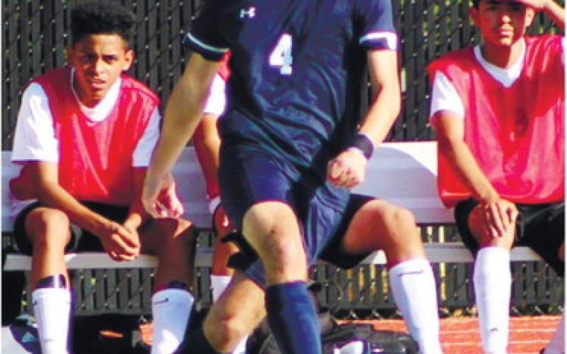 Fernando Salas (4) sends a cross across the field to a teammate. ARELLA CASH/Staff