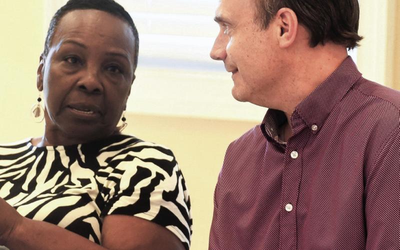 JDP Council Chair Janie Reid shares a moment with County Commissioner Richard Garrett after a meeting at Jimmy Davis Park last week.  IAN TOCHER/Staff