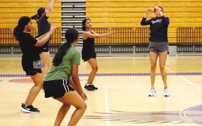 Players take coaching on technique. ARELLA CASH/ S t a ff