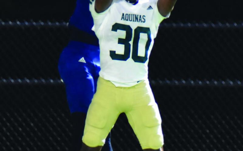 Putnam wide out Zalen Clemons goes up to battle for the only pass of the night by the War Eagles. BRANDON PARK/Staff
