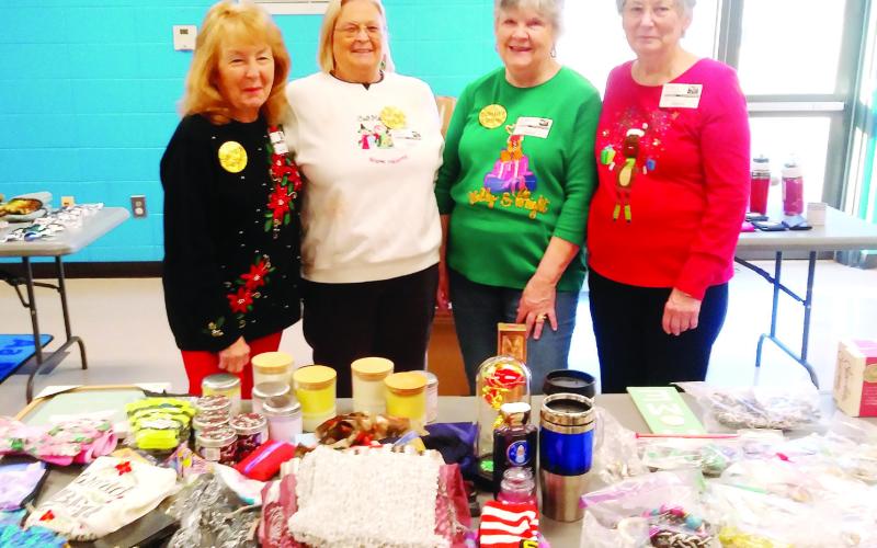 L-R: Judy Fain, Linda Pressley, Gail Mills and Leonell Alligood work as Santa’s helpers at Santa’s Secret Workshop. CONTRIBUTED