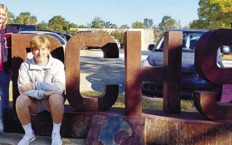 Tori Sheppard and Trenton Lewis on the PCHS sign in front of the high school. CONTRIBUTED
