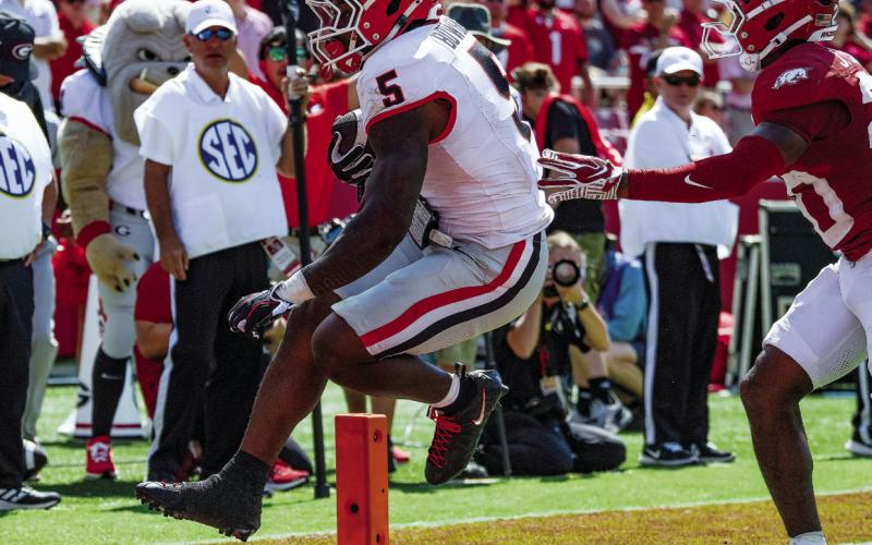 Georgia running back Chauncey Bowens scampers into the end zone for a touchdown against the Arkansas Razorbacks. He scored three times on the ground in Fayetteville. COURTESY OF UGA ATHLETICS