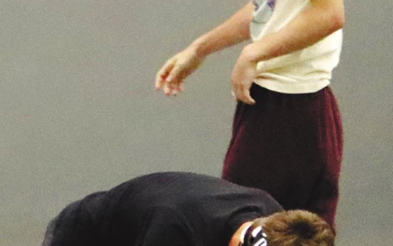 Wyatt Stanley (standing) makes a move on opponent. ARELLA CASH/Staff