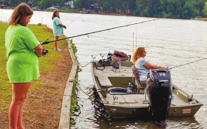 Becky Lawson spends a quiet time fishing with her granddaughters Lexi Wynn and Maddie Kapp.