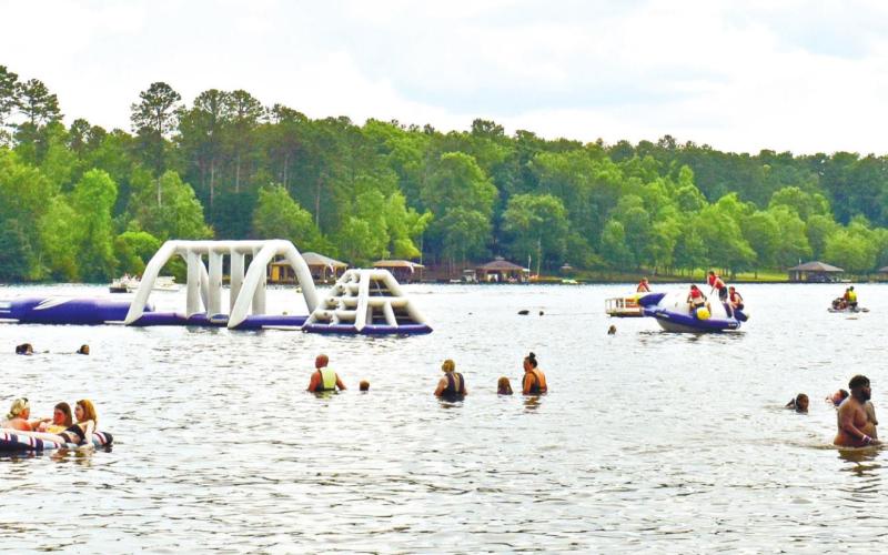 Lots of visitors have fun in the water at the park.