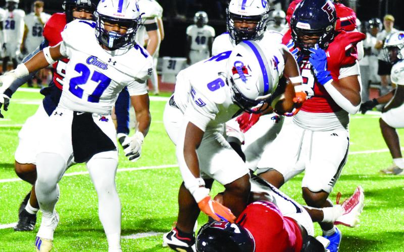 Jasper County running back Chance Ross (6) tries to stay balanced as a Putnam County defender tries to bring him down. T. MICHAEL STONE/Staff