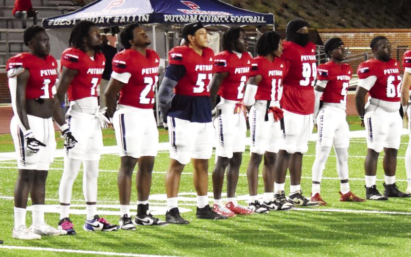 Putnam County’s seniors line up as captains before the team took the field against rival Jasper County last Friday. T. MICHAEL STONE/Staff