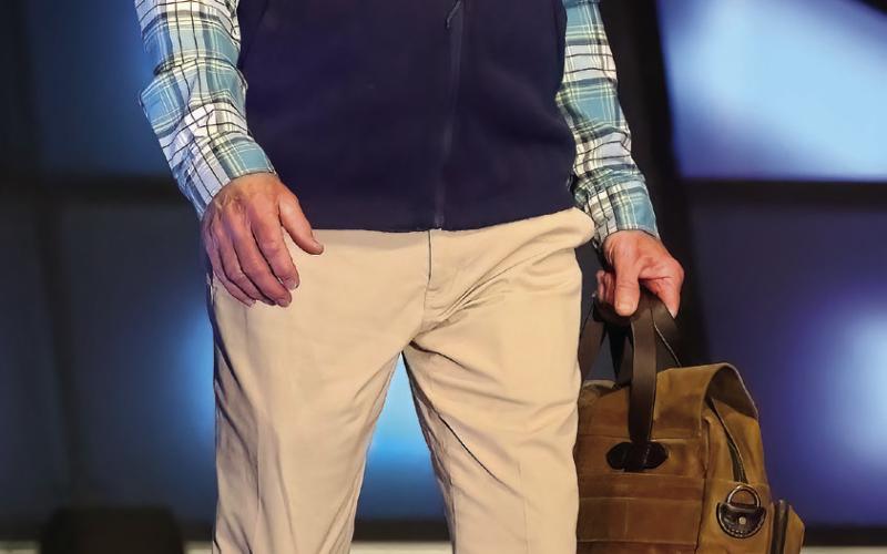 Following his wife on the catwalk, was Julian Suggs, as dapper as ever. LEIGH LOFGREN/Staff