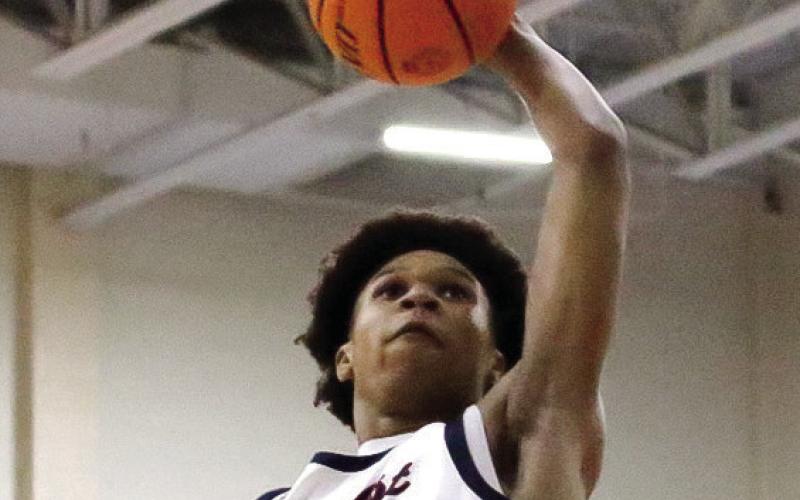 Putnam County’s Jeremy Banks goes up for a dunk in a win over Southwest Atlanta Christian on Jan. 13. TREY NORRIS/Staff