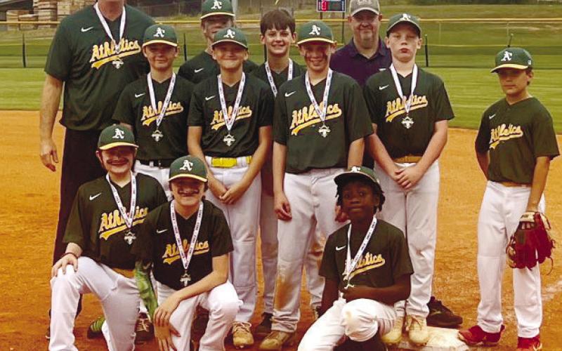 The Putnam A’s pose for a photo after winning the 11-and-12-year-old league championship. CONTRIBUTED