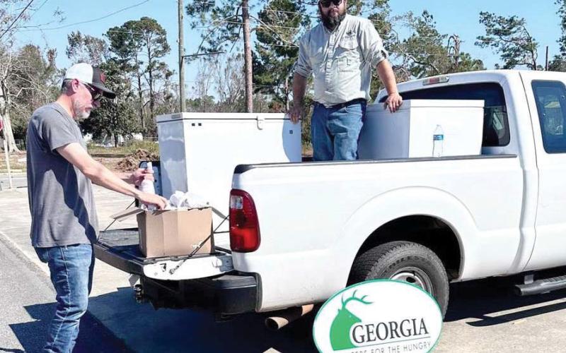 Earlier this fall, Georgia Wildlife Federation’s Sportsman’s Programs Specialist John Guthrie (left) and Sportsman’s Programs Manager Adam Schiavone dropped off more than 800 pounds of donated deer meet in Uvalda. CONTRIBUTED