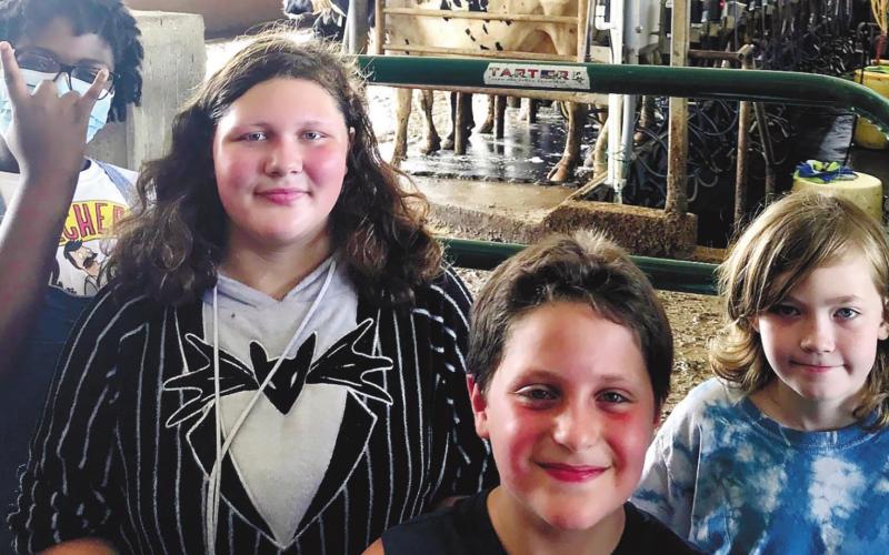 Campers learn about the operation of a dairy farm at Tim Camp’s Dairy. GRAYSON HUSKIN/Contributed