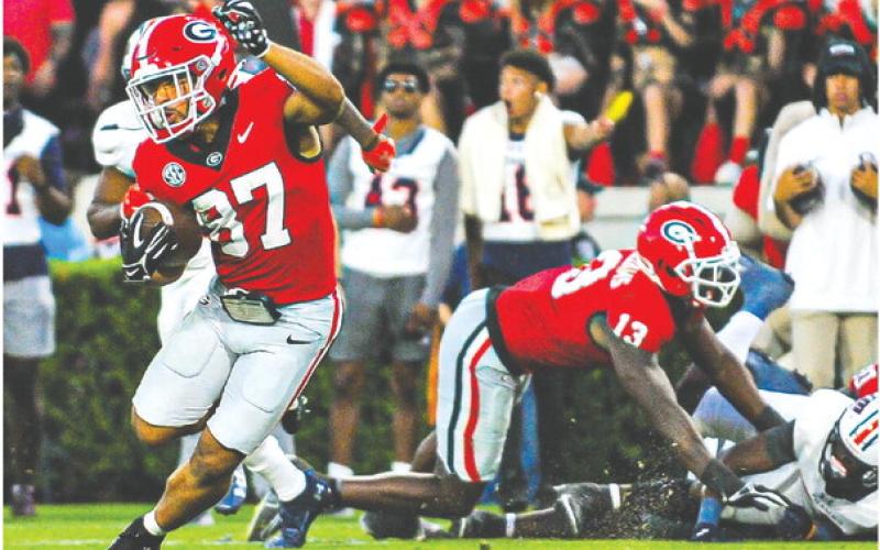 Georgia wide receiver Mehki Mews (87) breaks away from defenders on a 54-yard touchdown during Saturday’s win over UTMartin. CHARLES JORDAN/Contributed
